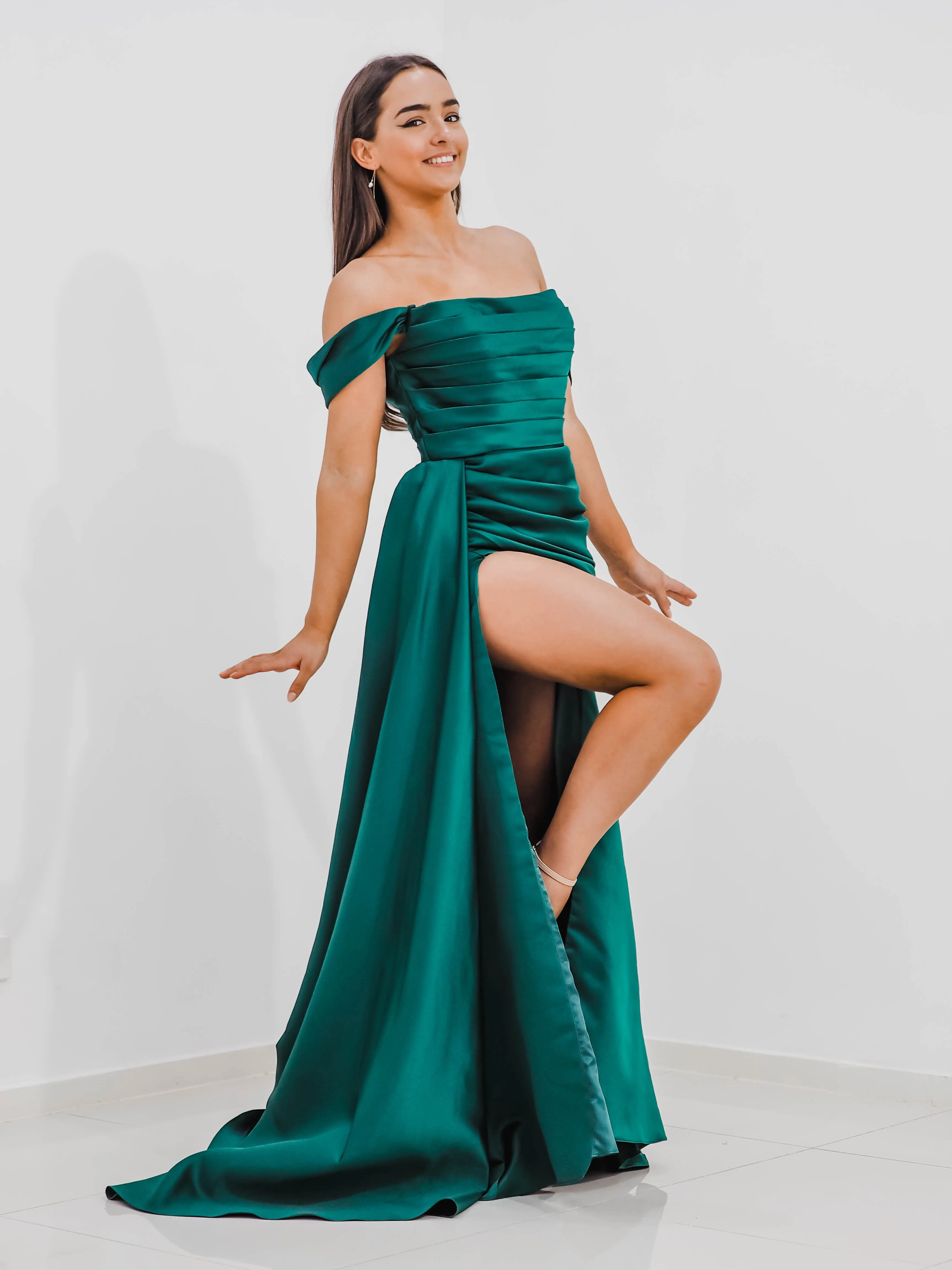 Emerald green Satin column dress with off the shoulder sleeves and high slit